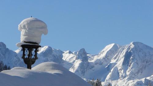 a snow man on top of a snow covered mountain at Landhaus Zaglauhof in Werfenweng