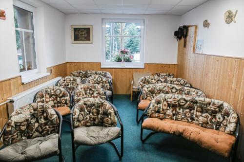 a row of chairs in a waiting room at Chata Bajama in Bedřichov