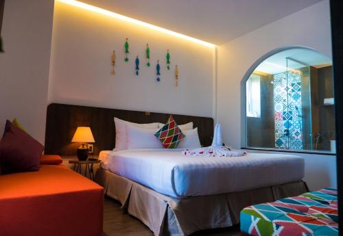 Кровать или кровати в номере Santori Hotel Da Nang Bay