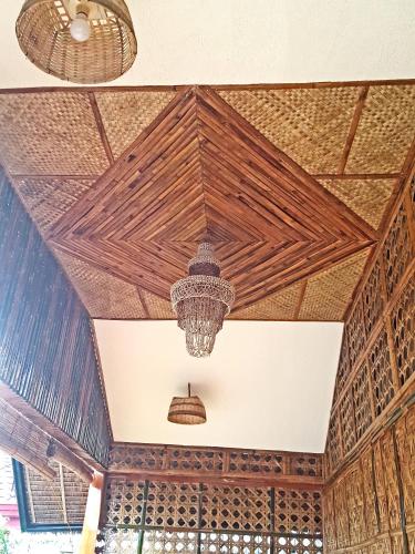 a ceiling of a building with a chandelier at MJ Room Rental in Panglao