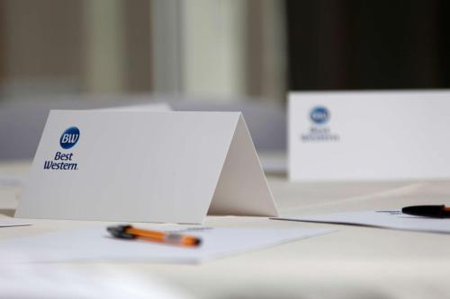 two boxes sitting on a table with a pen at Deincourt Hotel in Newark upon Trent