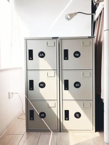 two metal file cabinets in a room with a lamp at Ahiruyah Guesthouse in Kaohsiung