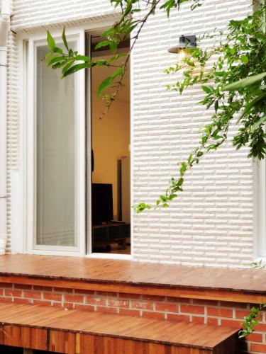 a window on the side of a house at Gallery Family Hotel in Mokpo