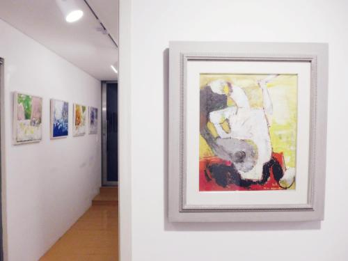 a painting on a wall in a hallway at Gallery Family Hotel in Mokpo