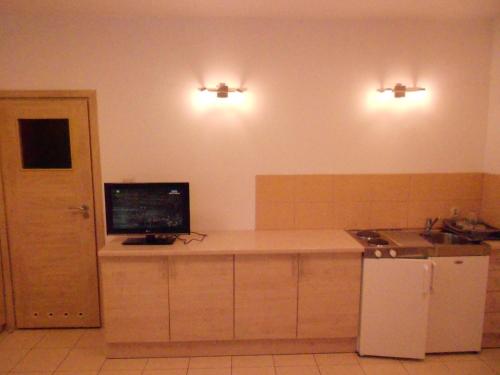 a kitchen with a counter with a computer on it at Standard Delegacyjny Bed & Breakfast in Dąbrowa Górnicza