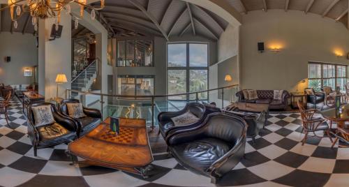 a living room with chairs and a table at Aegli Arachova in Arachova