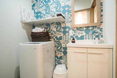 a bathroom with a toilet and a sink at KYOSTAY Iroha Komichi in Kyoto