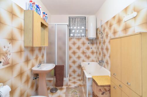 a bathroom with two sinks and a shower at Apartment with nice terrace 684 in Štinjan
