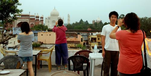 a group of people taking pictures of the city at Hotel Kamal Nearest To Taj Mahal in Agra