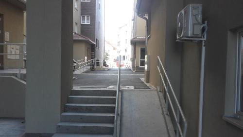 an empty alley with stairs in a building at Olivia in Jagodina