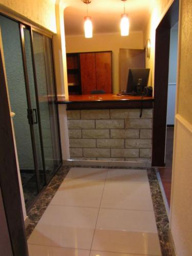 an empty room with a counter in a room at Road Stay in Maseru