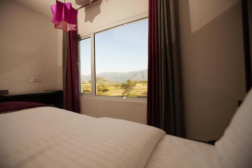 Postel nebo postele na pokoji v ubytování Hotel Visakka Palani