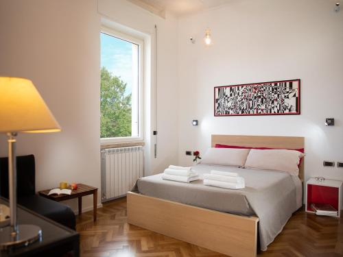 Säng eller sängar i ett rum på Room In Roma Isole