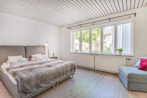 A bed or beds in a room at City Apartments in Jonkoping
