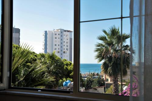 a view of the ocean from a window at Hotel Veliera in Durrës
