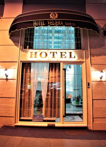 a hotel sign on the front of a building at Hotel Veliera in Durrës