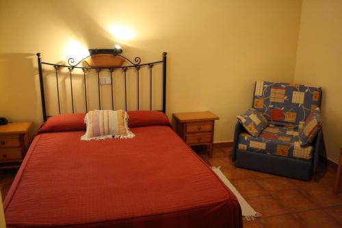 Ένα ή περισσότερα κρεβάτια σε δωμάτιο στο Hostal La Balquina