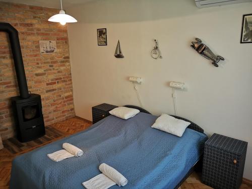 Postel nebo postele na pokoji v ubytování Ráday Apartman