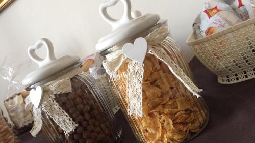 a couple of containers filled with food and cookies at Locanda 130 in Fonni