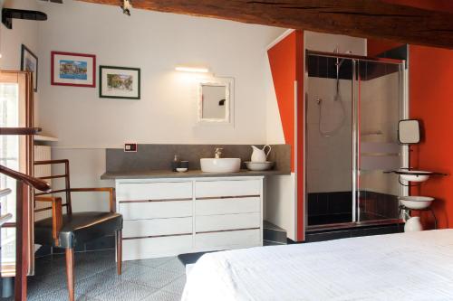 a bathroom with a sink and a shower at B&B MI Casa Tu Casa in Pavia