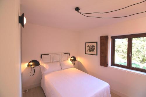 מיטה או מיטות בחדר ב-La Curia