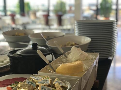 a table topped with plates and bowls of food at Bugday Hotel in Ankara