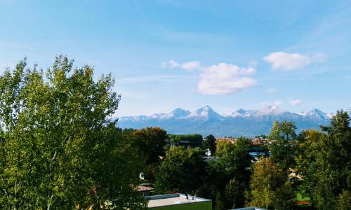 a view of snow capped mountains in the distance at Mountain View Studio Apartment in Poprad