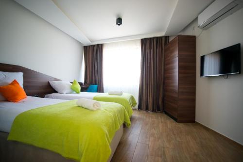 Una cama o camas en una habitación de Apel Luxury