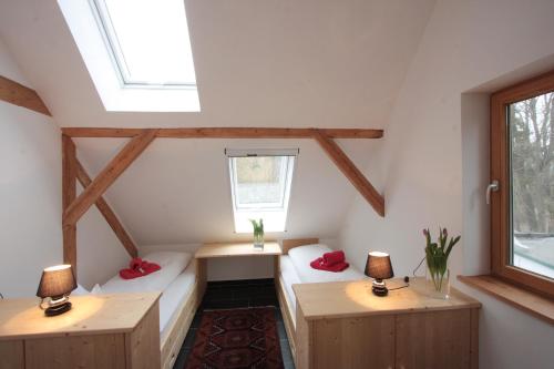 a small room with two tables and two lamps at EL MOLINO - ehemalige Mühle mit großem Gartenareal in Modlisch