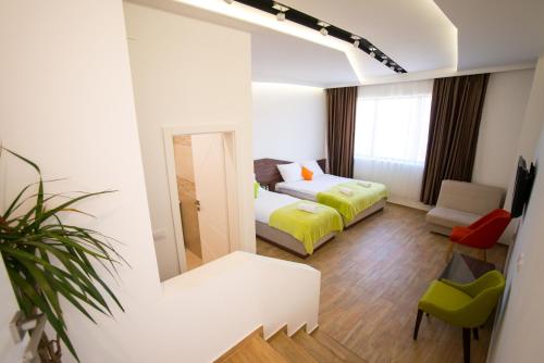 En eller flere senger på et rom på Garni Hotel Apel Apartments