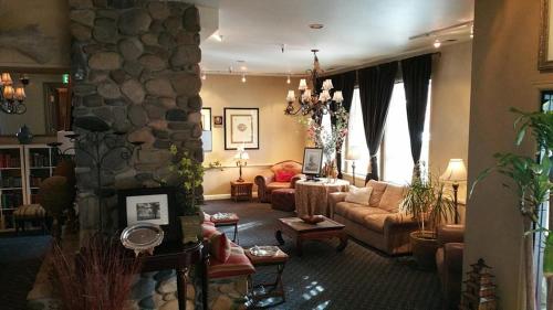 a living room with a couch and a stone wall at Lodge at Kingsbury Crossing in Stateline