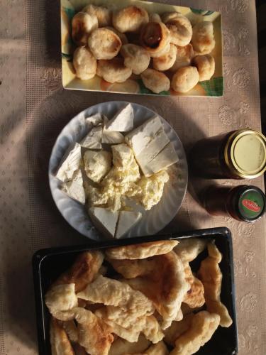 a table topped with two plates of food with snacks at Holiday Home Vila Milka in Kremna