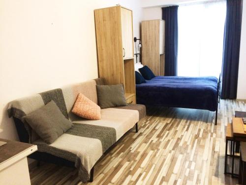 Gudauri loft -Apartment tesisinde bir odada yatak veya yataklar