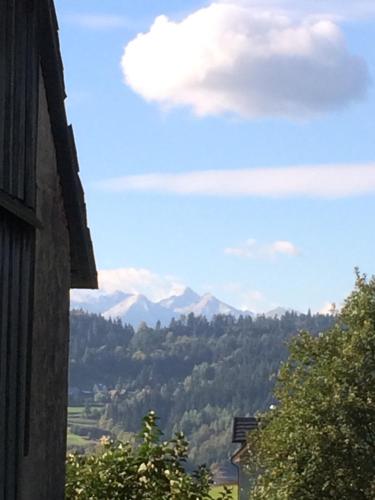 a view of the mountains from a window of a building at Ciche Pole in Maniowy
