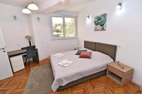 Posteľ alebo postele v izbe v ubytovaní Fran Green & Blue apartment