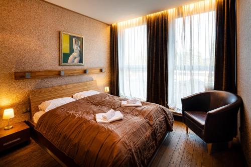 Ένα ή περισσότερα κρεβάτια σε δωμάτιο στο Old Riga Central Apartment