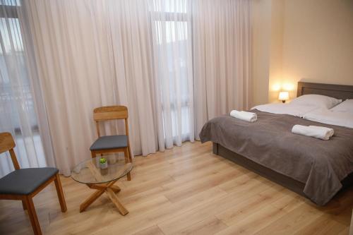 Кровать или кровати в номере Avlabari Terrace