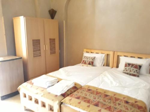 Ένα ή περισσότερα κρεβάτια σε δωμάτιο στο Embrace Hotel