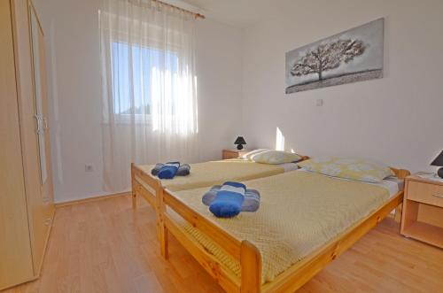 Ένα ή περισσότερα κρεβάτια σε δωμάτιο στο Apartment Marija