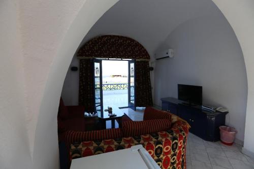 a living room with a couch and a window at New Panorama Resort in Fayoum