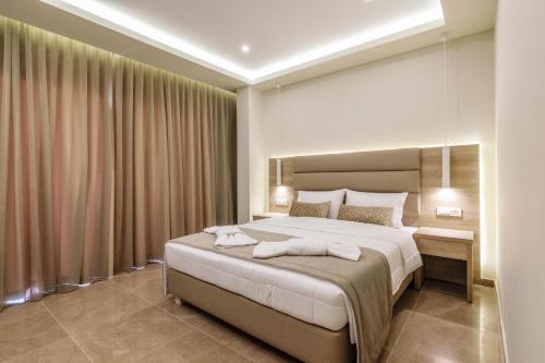 Posteľ alebo postele v izbe v ubytovaní Remezzo Studios & Apartments