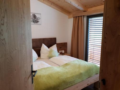a bedroom with a bed with a large window at Binter Apartments in Virgen