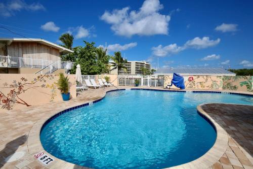 a large swimming pool with blue water at Gilbert's Resort in Key Largo