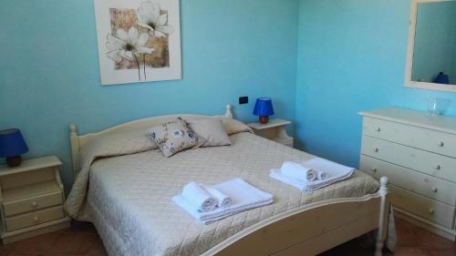 Un pat sau paturi într-o cameră la Appartamento Yucca