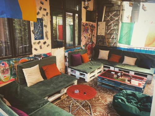 a living room filled with furniture and pillows at Hostel in Batumi in Batumi
