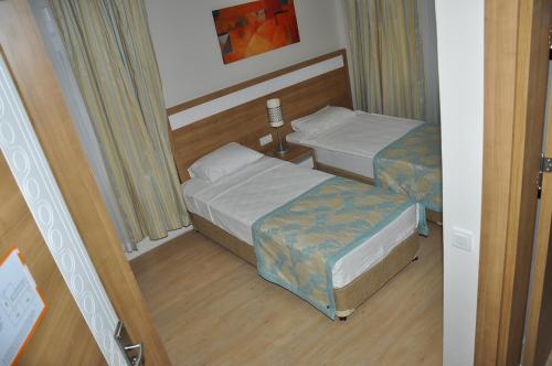Letto o letti in una camera di Merve Sun Hotel & SPA