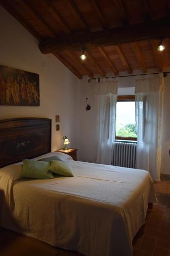 Un ou plusieurs lits dans un hébergement de l'établissement Agriturismo Spazzavento