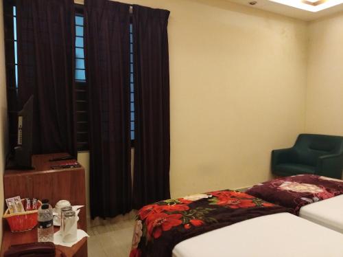 Cama o camas de una habitación en Bottomhill Palace Hotel