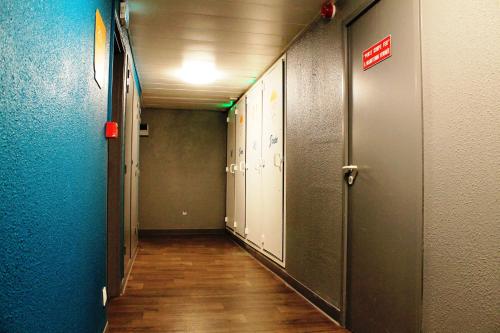 a hallway of an office building with a hallway at hotelF1 Paris Gennevilliers, 4 Rue Georges Corète 92230 Gennevilliers in Gennevilliers