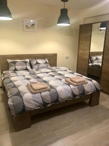 a large bed with pillows on it in a room at Sofia Family House - Free Parking in Sofia